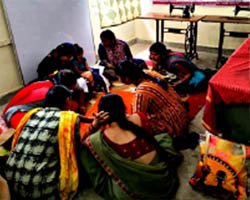 Indian women artisans working together on handcraft